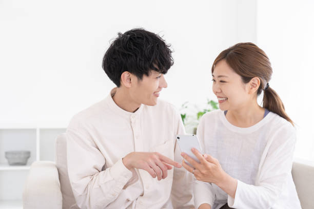 Asian couple at modern home , smart phone